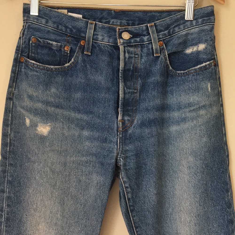 Levi's Women's Straight Leg Jeans in Classic Blue with Light Distressing